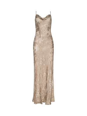 The Christine Burnout Satin Gown is a sleeveless, floor-length champagne dress with thin spaghetti straps and a subtle floral lace pattern, shown on a white background.