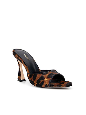 The Avery Open-Toe Mule is a sculpted stiletto mule with a bold leopard hair calf pattern, wide strap, open toe, slightly flared heel, and a black insole stamped with L’Agence in gold.