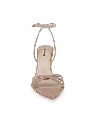 The Dua Suede Sandal is a tan suede shoe with thin crisscross front straps, an ankle buckle strap, and an open toe. Shown from the front on a white background.